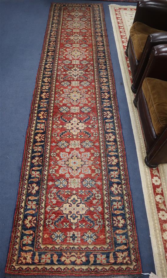 A Kazak red runner Approx. 360 x 80cm